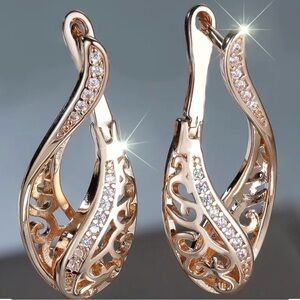 Elegant Bohemian Synthetic Zirconia Floral Vile Hollow Earrings.